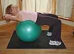 Starting position for this ab exercise with exercise ball. This is the beginner crunch.