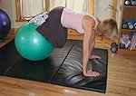 Jackknife crunch with an exercise ball